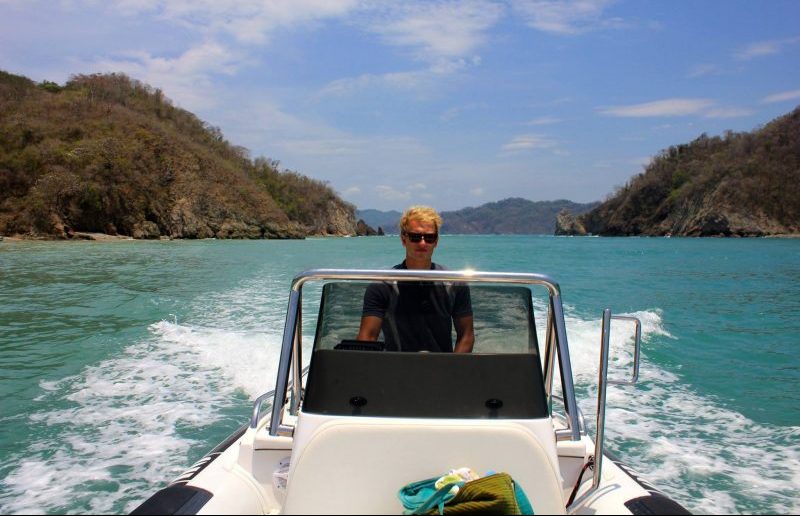 Deckhand driving a tender boat