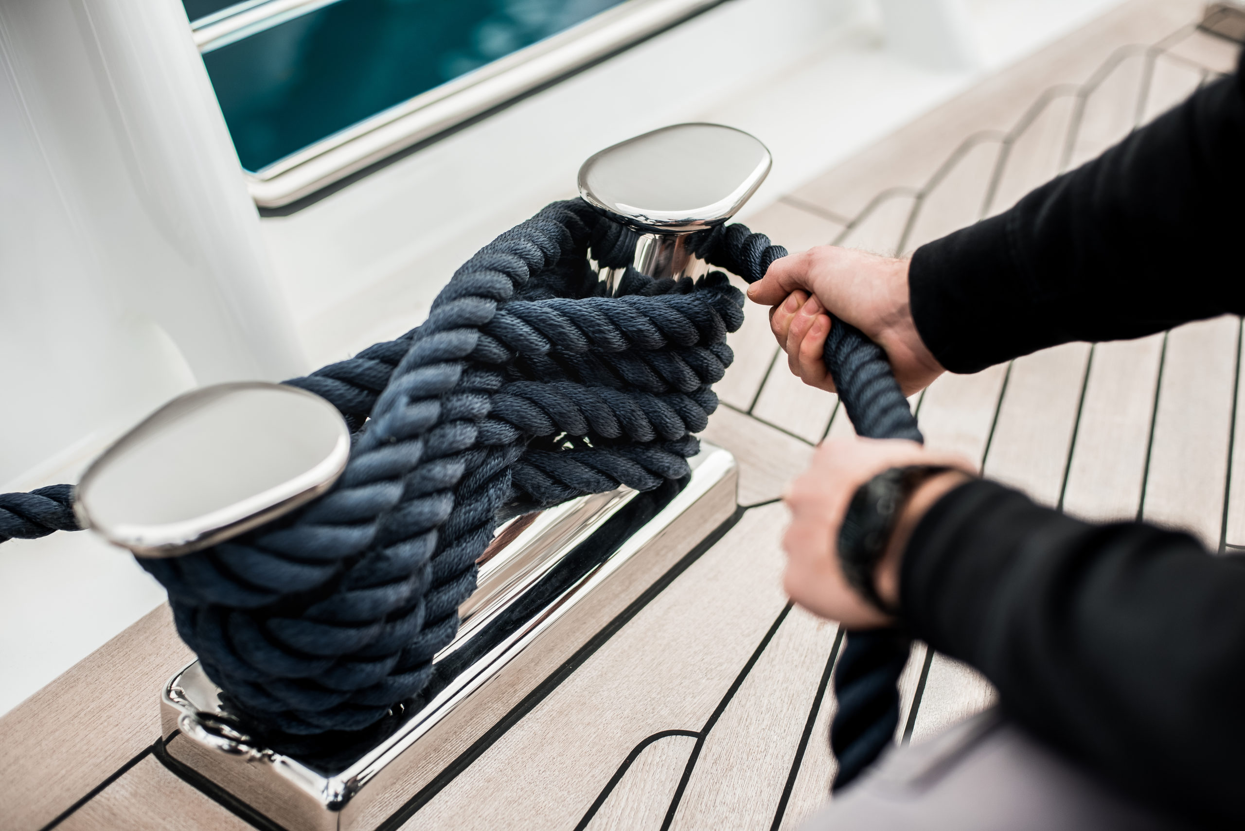 Detail,Of,Hands,Cleating,Off,Superyacht,Mooring,Lines,On,The