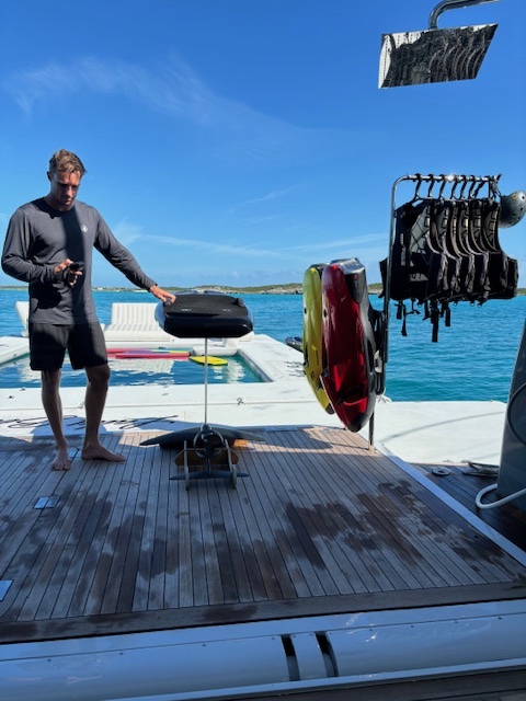 deck crew member with lithium ion powered watersports toys