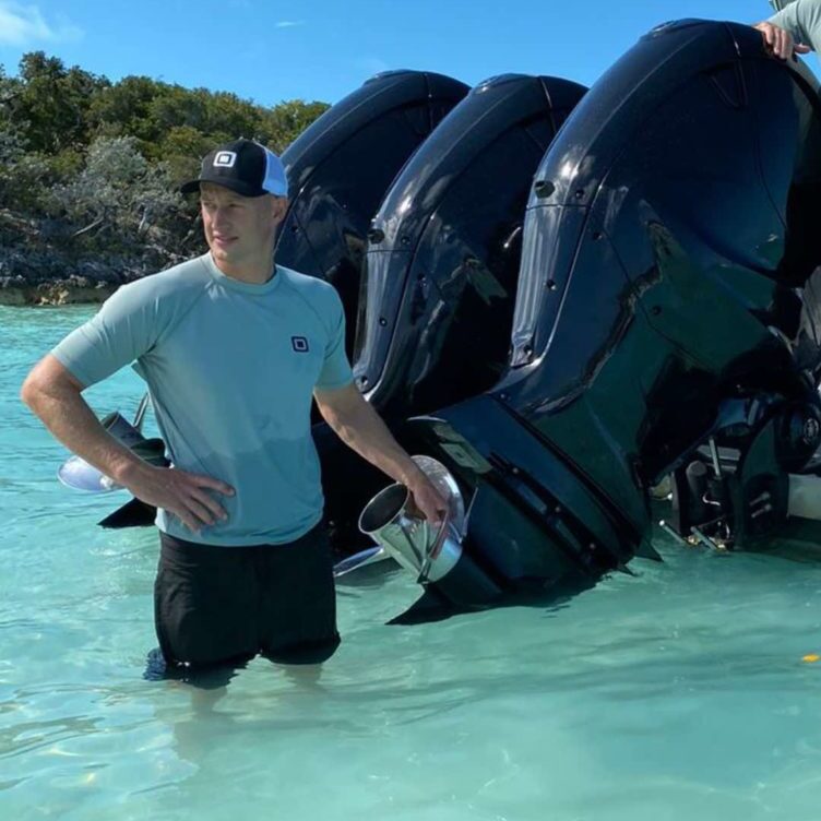 Deckhand Next to Yacht Tender